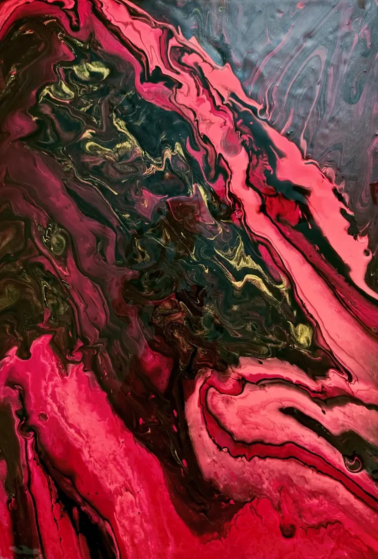 A poured painting read as an aerial view: a ridge of dark olive, black and gold runs diagonally across the canvas like a mountain range seen from a great height, with hot magenta and coral flowing away on either side and a cool grey-blue haze in the upper corner.